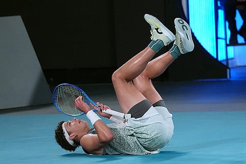 Ben Shelton of the U.S. falls during his quarterfinal match against Jannik Sinner of Italy at the Australian Open tennis championship in Melbourne, Australia.