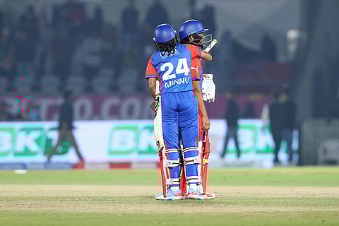 Delhi Capitals players Niki Prasad and Minnu Mani at the end of play during the Women’s Premier League (WPL) 2026 T20 cricket match against Gujarat Giants, at the BCA Stadium, in Vadodara, Gujarat.
