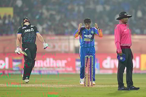 India's Kuldeep Yadav celebrates the dismissal of New Zealand's Glenn Phillips during the fourth T20 cricket match between India and New Zealand in Visakhapatnam.