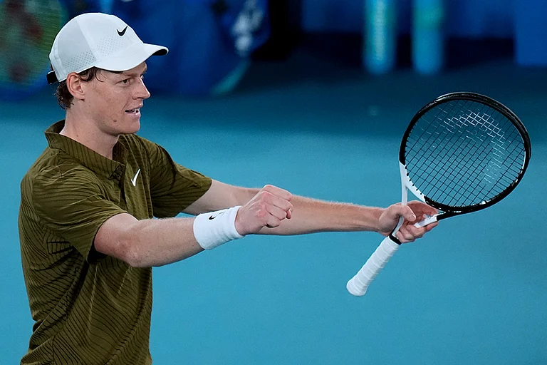 Jannik Sinner of Italy reacts after defeating Ben Shelton of the U.S. in their quarterfinal match at the Australian Open tennis championship in Melbourne, Australia. - | Photo: AP/Dar Yasin