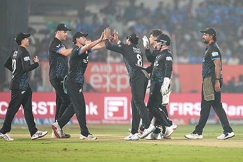 New Zealand's captain Mitchel Santner celebrates the dismissal of India's Hardik Pandya with his teammates during the fourth T20 cricket match between India and New Zealand in Visakhapatnam.