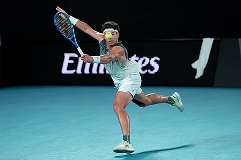 Ben Shelton of the U.S. plays a backhand return to Jannik Sinner of Italy during their quarterfinal match at the Australian Open tennis championship in Melbourne, Australia.