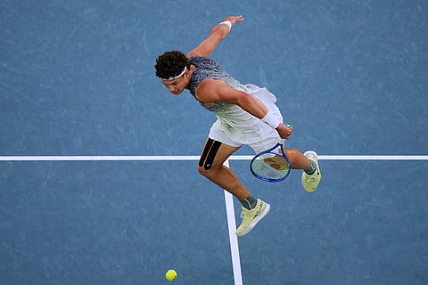 Ben Shelton of the U.S. plays a backhand return to Jannik Sinner of Italy during their quarterfinal match at the Australian Open tennis championship in Melbourne, Australia.