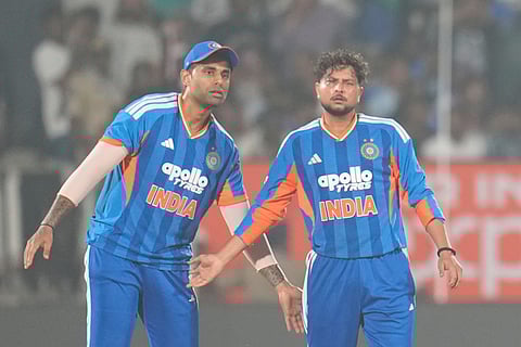 India's Kuldeep Yadav, right, celebrates with captain Suryakumar Yadav after taking wicket of New Zealand's Devon Conway during the fourth T20 cricket match between India and New Zealand in Visakhapatnam.