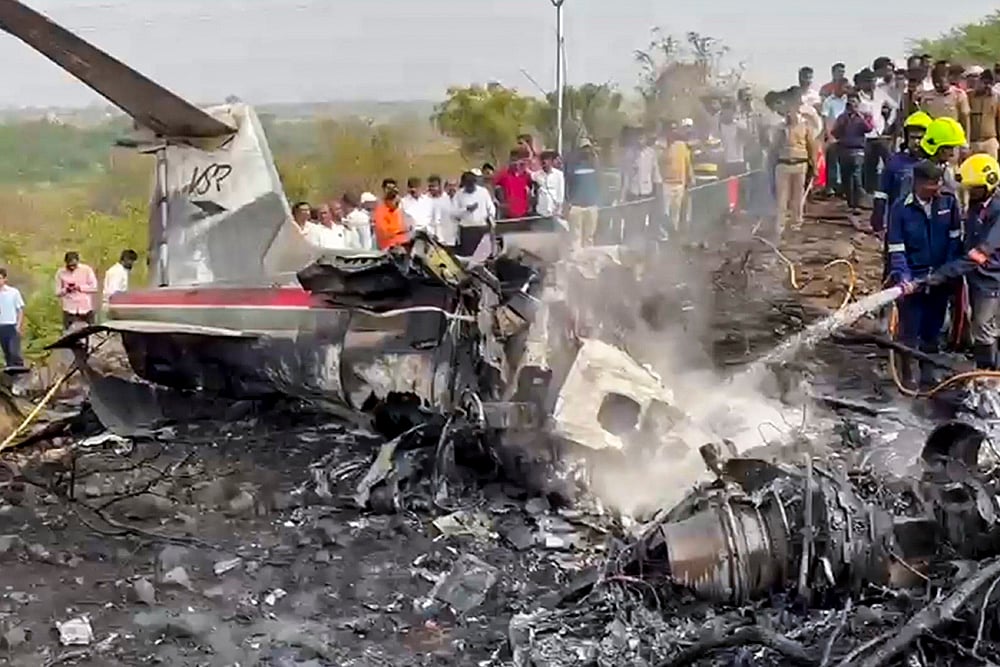 Firefighters at the site after an aircraft carrying Maharashtra Deputy Chief Minister Ajit Pawar crashed during landing, at Baramati in Pune district, Maharashtra. - | Photo: PTI