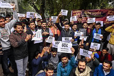 Students protest against the UGC Act at the Arts Faculty of Delhi University, in New Delhi.