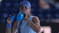 AP/Dita Alangkara : Iga Swiatek of Poland takes a drink during her quarterfinal match against Elena Rybakina.