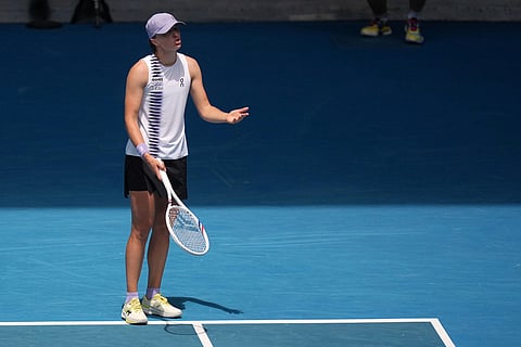 Iga Swiatek of Poland gestures as she questions a line call during her quarterfinal against Elena Rybakina of Kazakhstan at the Australian Open tennis championship in Melbourne, Australia.