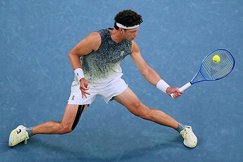 Ben Shelton of the U.S. plays a forehand return to Jannik Sinner of Italy during their quarterfinal match at the Australian Open tennis championship in Melbourne, Australia.