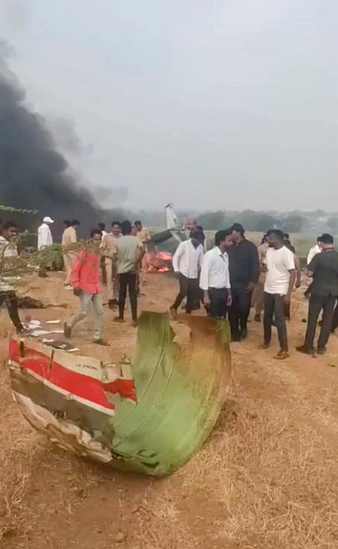 Locals gather after an aircraft carrying Maharashtra Deputy Chief Minister Ajit Pawar crashed during landing, at Baramati in Pune district, Maharashtra.