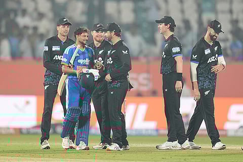 India's Kuldeep Yadav talks to New Zealand players after New Zealand won fourth T20 cricket match against India in Visakhapatnam.