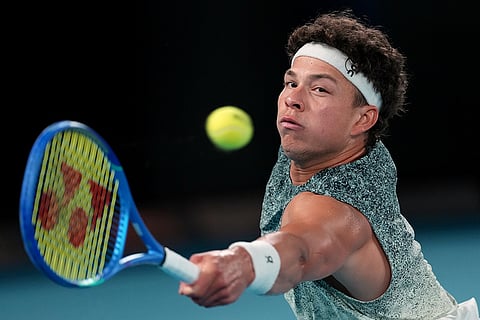 Ben Shelton of the U.S. plays a backhand return to Jannik Sinner of Italy during their quarterfinal match at the Australian Open tennis championship in Melbourne, Australia.