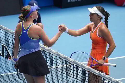 Jessica Pegula, right, of the U.S. is congratulated by Amanda Anisimova following their quarterfinal match at the Australian Open tennis championship in Melbourne, Australia.