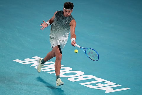 Ben Shelton of the U.S. plays a forehand return to Jannik Sinner of Italy during their quarterfinal match at the Australian Open tennis championship in Melbourne, Australia.