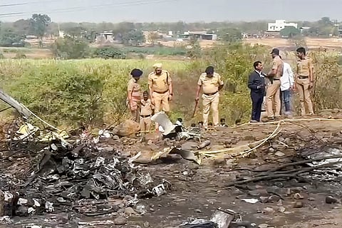 Police officials at the spot after an aircraft carrying Maharashtra Deputy Chief Minister Ajit Pawar crashed during landing, near Baramati in Pune district, Maharashtra.