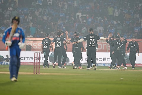 New Zealand players celebrate the dismissal of India's Abhishek Sharma during the fourth T20 cricket match between India and New Zealand in Visakhapatnam.