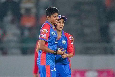 Delhi Capitals' Sree Charani celebrates the wicket of Gujarat Giants' Kashvee Gautam with captain Jemimah Rodrigues during the Women's Premier League (WPL) 2026 T20 cricket match between Gujarat Giants and Delhi Capitals, at BCA Stadium, in Vadodara, Gujarat.