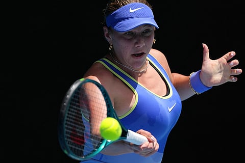 Amanda Anisimova of the U.S. plays a forehand return to compatriot Jessica Pegula during their quarterfinal match at the Australian Open tennis championship in Melbourne, Australia.