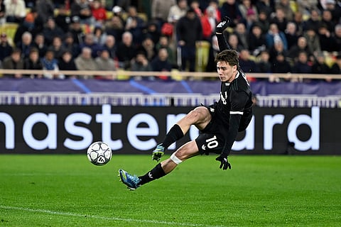 Juventus' Kenan Yildiz shoots the ball during the Champions League opening phase soccer match between Monaco and Juventus in Monaco.