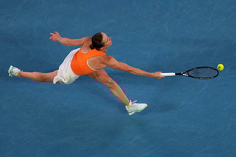 Elina Svitolina of Ukraine plays a forehand return to Aryna Sabalenka of Belarus during their semifinal match at the Australian Open tennis championship in Melbourne, Australia.