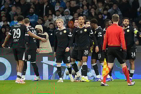 Chelsea's Joao Pedro celebrates with his teammates after scoring his side's third goal during a Champions League opening phase soccer match between Napoli and Chelsea, in Naples, Italy.