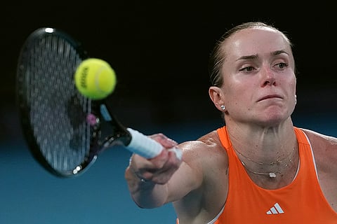 Elina Svitolina of Ukraine plays a forehand return to Aryna Sabalenka of Belarus during their semifinal match at the Australian Open tennis championship in Melbourne, Australia.