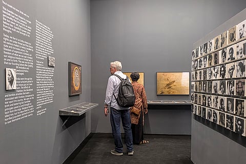 Visitors at an exhibition running parallel to the ongoing Kochi-Muziris Biennale in Fort Kochi, Kerala. The exhibition, 'You I Could not Save, Walk With Me', chronicles the last two years of Mahatma Gandhi's life, retracing his footsteps in Noakhali (now in Bangladesh), Bihar, Kolkata and Delhi. 