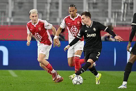 Monaco's Aleksandr Golovin, left, and Thilo Kehrer, centre, challenge for the ball with Juventus' Francisco Conceicao during the Champions League opening phase soccer match between Monaco and Juventus in Monaco.