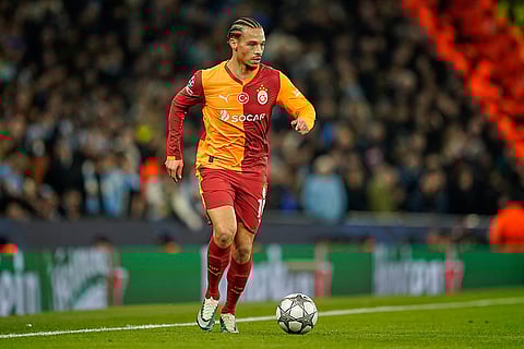 Galatasaray's Leroy Sane runs with the ball during the Champions League opening phase soccer match Manchester City and Galatasaray in Manchester, England.