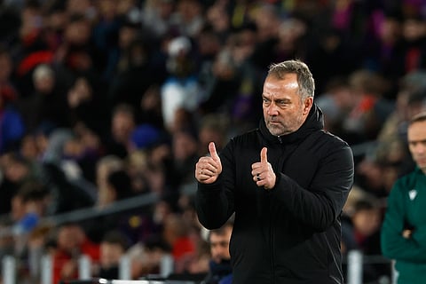 Barcelona's head coach Hansi Flick reacts during the Champions League opening phase soccer match between Barcelona and Copenhagen in Barcelona, Spain.