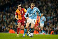 | Photo: AP/Dave Thompson : Manchester City's Erling Haaland is chased by Galatasaray's Roland Sallai during the Champions League opening phase soccer match between Manchester City and Galatasaray in Manchester, England.