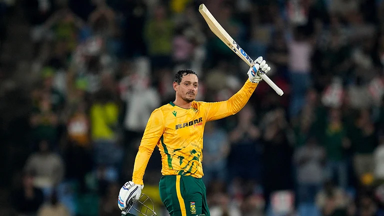 South Africa's batsman Quinton de Kock raises his bat after reaching a century during the T20 International cricket match between South Africa and West Indies, in Centurion, South Africa, Thursday, Jan. 29, 2026. - (AP Photo/Themba Hadebe)
