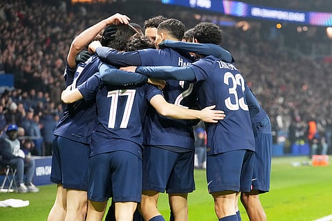 PSG players celebrate after PSG's Vitinha scored his side's opening goal during a Champions League opening phase soccer match between Paris Saint-Germain and Newcastle in Paris.
