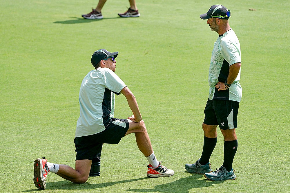 New Zealand's captain Mitchell Santner, left, with head coach Rob Walter during a training session ahead of the fifth and final T20I cricket match between India and New Zealand, at the Greenfield International Stadium, in Thiruvananthapuram. - | Photo: PTI/R SenthilKumar
