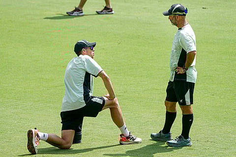 New Zealand's captain Mitchell Santner, left, with head coach Rob Walter during a training session ahead of the fifth and final T20I cricket match between India and New Zealand, at the Greenfield International Stadium, in Thiruvananthapuram.