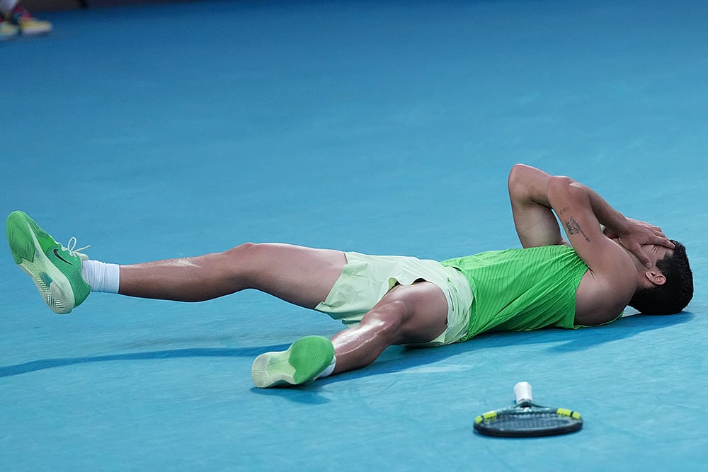 Carlos Alcaraz of Spain celebrates after defeating Alexander Zverev of Germany in their semifinal match at the Australian Open tennis championship in Melbourne, Australia. - | Photo: AP/Aaron Favila