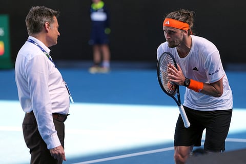 Alexander Zverev of Germany gesturers to a tournament official during his semifinal match against Carlos Alcaraz of Spain at the Australian Open tennis championship in Melbourne, Australia.