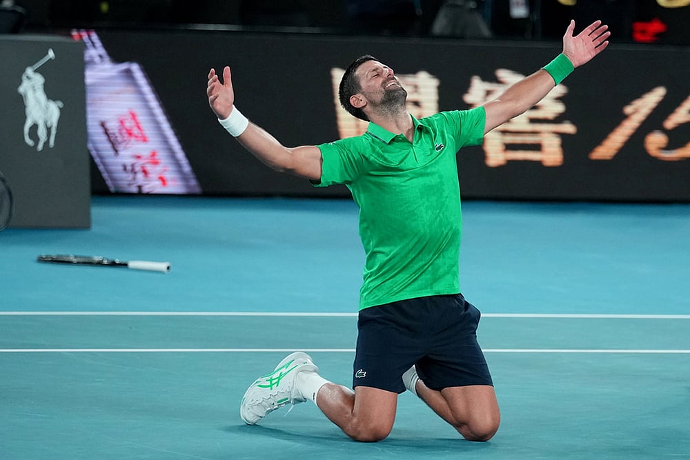 Novak Djokovic of Serbia celebrates after defeating Jannik Sinner of Italy in their semifinal match at the Australian Open tennis championship in Melbourne, Australia. - | Photo: AP/Dita Alangkara