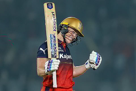 Royal Challengers Bengaluru's Grace Harris celebrates her half-century during a Women's Premier League (WPL) 2026 T20 International cricket match between Royal Challengers Bengaluru and UP Warriorz, at BCA Stadium, in Vadodara, Gujarat. 