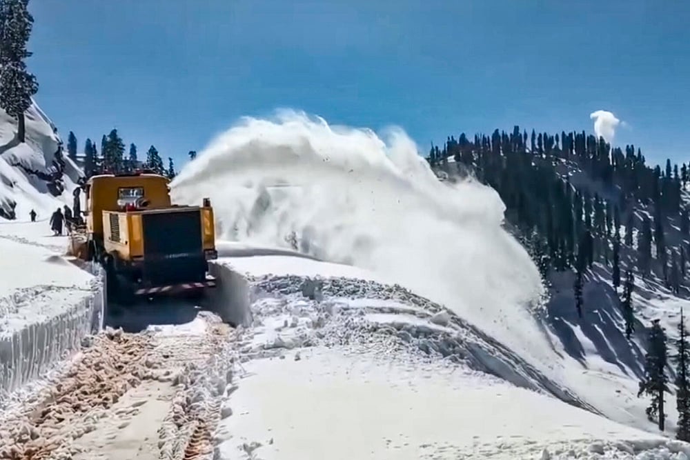 A machine being used by Border Roads Organisation (BRO) to clear snow from Budhal-Mahore-Gool road, in Rajouri, Jammu and Kashmir. - | Photo: PTI
