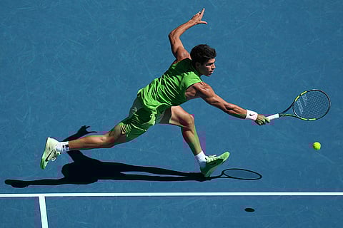 Carlos Alcaraz of Spain plays a backhand return to Alexander Zverev of Germany during their semifinal match at the Australian Open tennis championship in Melbourne, Australia.