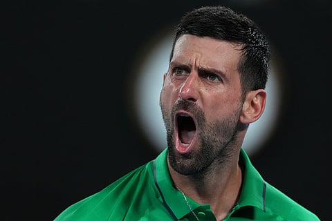 Novak Djokovic of Serbia reacts during his semifinal match against Jannik Sinner of Italy at the Australian Open tennis championship in Melbourne, Australia.