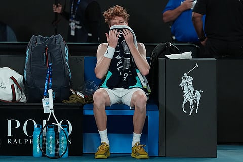 Jannik Sinner of Italy reacts during his semifinal match against Novak Djokovic of Serbia at the Australian Open tennis championship in Melbourne, Australia.