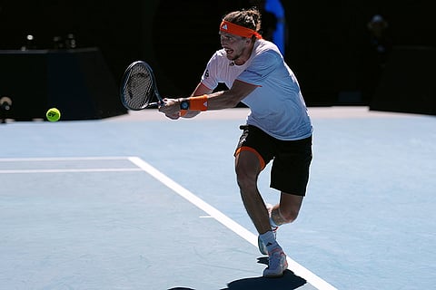 Alexander Zverev of Germany plays a backhand return to Carlos Alcaraz of Spain during their semifinal match at the Australian Open tennis championship in Melbourne, Australia.