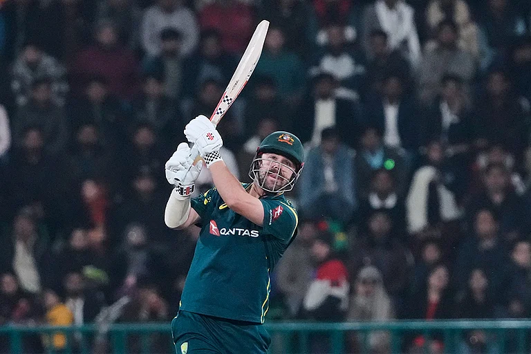 Australia's Travis Head reaches to his half-century in just 27 balls against Sri Lanka at the Pallekele International Cricket Stadium on February 16, 2026 - | Photo: AP/K.M. Chaudary