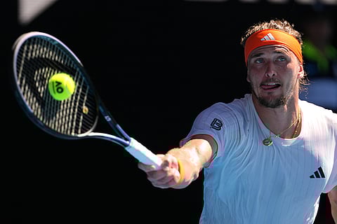Alexander Zverev of Germany plays a forehand return to Carlos Alcaraz of Spain during their semifinal match at the Australian Open tennis championship in Melbourne, Australia.