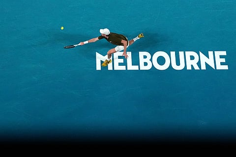Jannik Sinner of Italy plays a backhand return to Novak Djokovic of Serbia during their semifinal match at the Australian Open tennis championship in Melbourne, Australia.