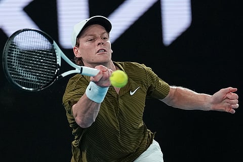 Jannik Sinner of Italy plays a forehand return to Novak Djokovic of Serbia during their semifinal match at the Australian Open tennis championship in Melbourne, Australia.