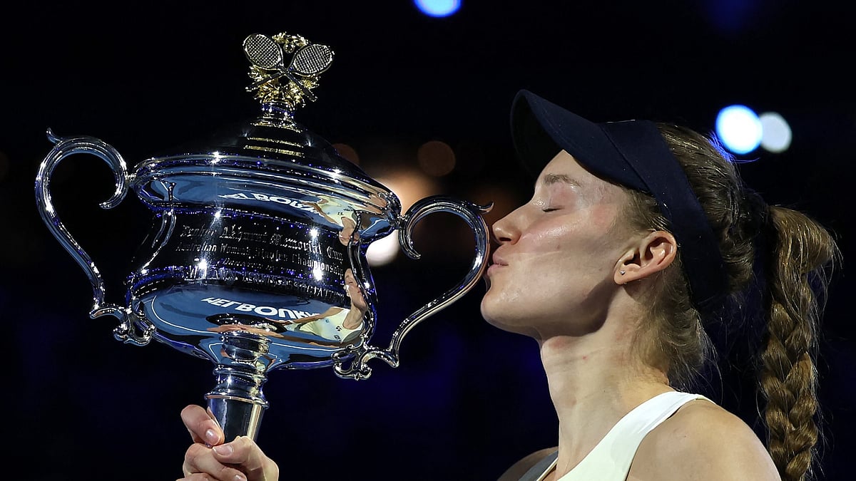 Elena Rybakina celebrating with the Australian Open 2026 title. - AustralianOpen/X