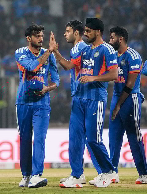 India's Axar Patel, left, celebrates with teammates after taking the wicket of New Zealand's Finn Allen during the fifth and final T201 cricket match between India and New Zealand, at the Greenfield International Stadium, in Thiruvananthapuram, Kerala.